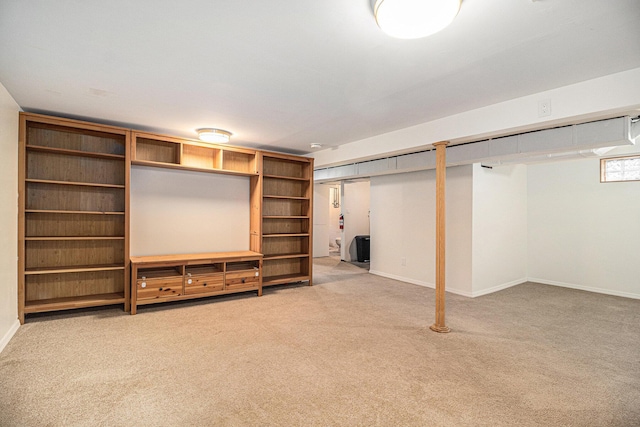 basement featuring light carpet