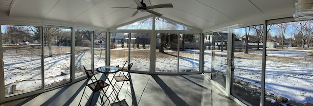 sunroom / solarium featuring lofted ceiling and ceiling fan