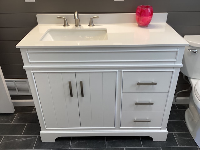 bathroom with sink, tile patterned floors, and toilet