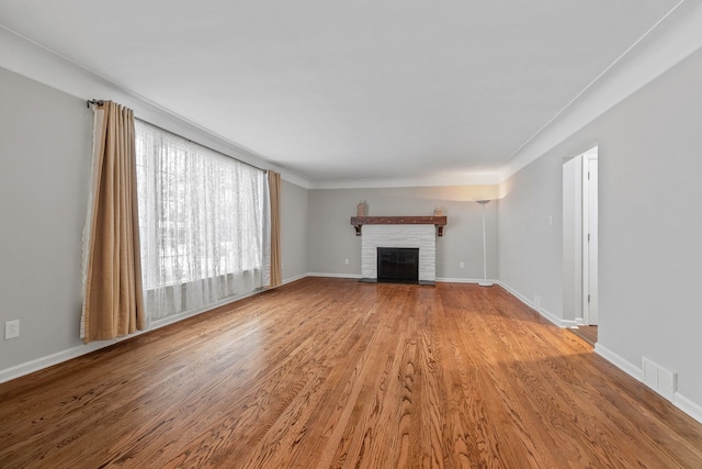 unfurnished living room with light wood-type flooring