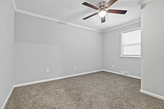 spare room featuring carpet floors, ornamental molding, and ceiling fan