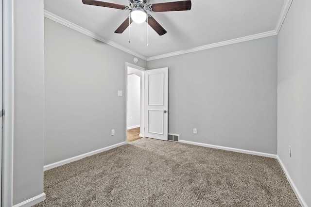 unfurnished room with ceiling fan, ornamental molding, and carpet floors