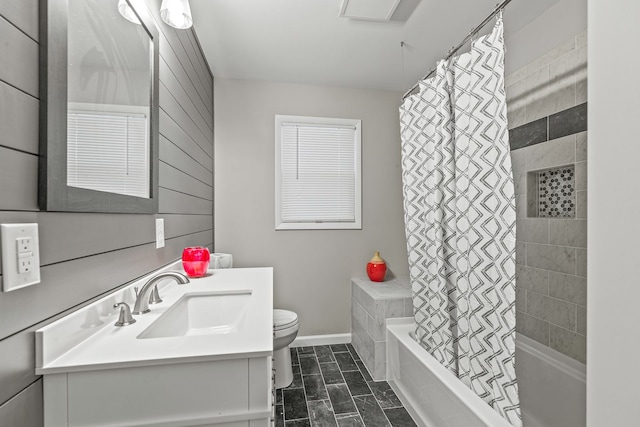 full bathroom with shower / tub combo with curtain, vanity, toilet, and wood walls