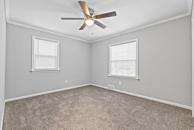 carpeted empty room featuring crown molding and ceiling fan