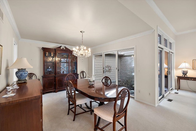 dining room with ornamental molding, light carpet, and a notable chandelier