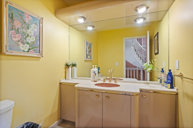 bathroom with vanity and toilet