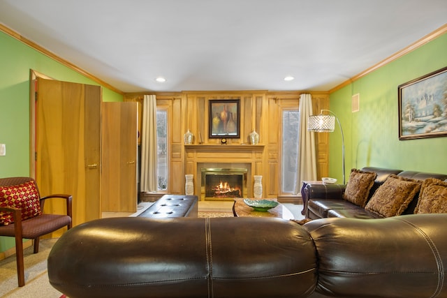 carpeted living room featuring ornamental molding