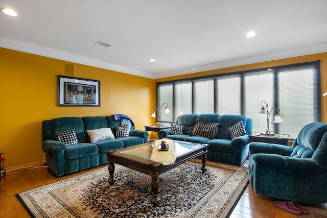 living room with hardwood / wood-style flooring and ornamental molding