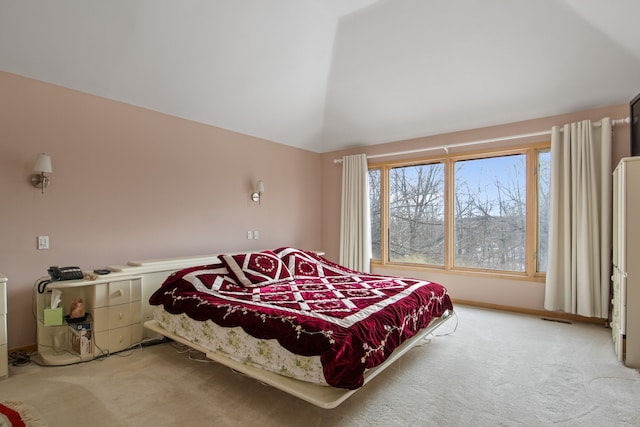 bedroom featuring carpet flooring and vaulted ceiling