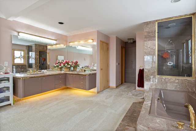 bathroom featuring vanity and separate shower and tub