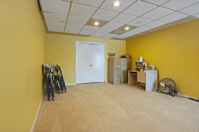 misc room featuring a drop ceiling and carpet floors