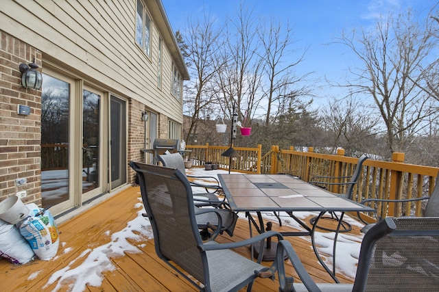 view of snow covered deck