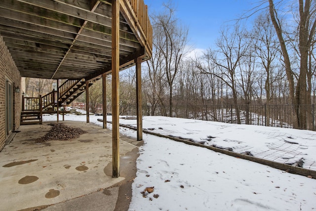 view of yard layered in snow