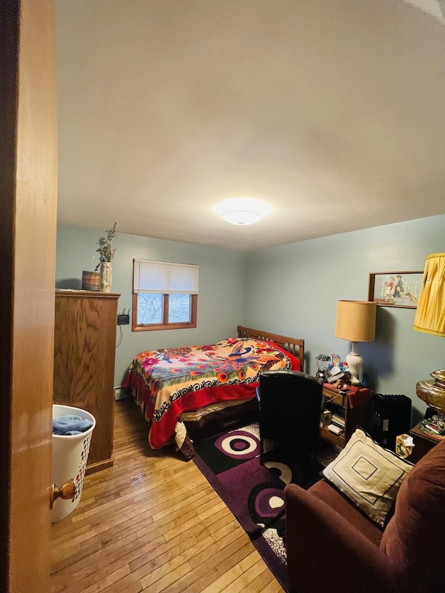 bedroom with wood-type flooring