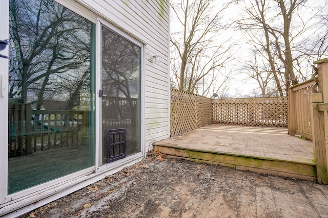 wooden deck with a patio