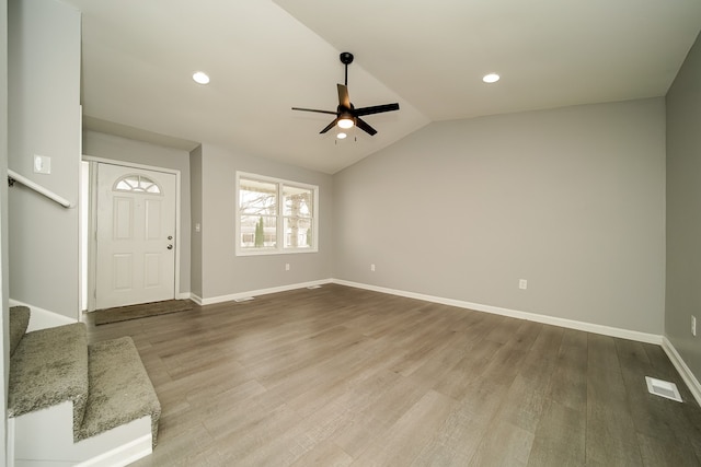 foyer featuring wood-type flooring, lofted ceiling, and ceiling fan