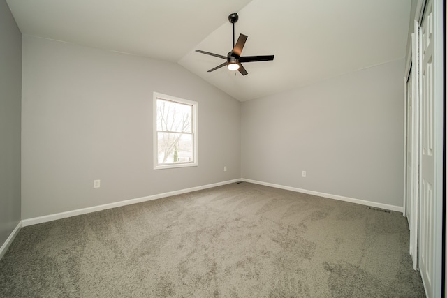 unfurnished bedroom with vaulted ceiling, carpet, and ceiling fan