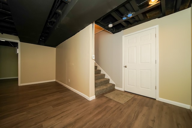 basement featuring dark hardwood / wood-style floors