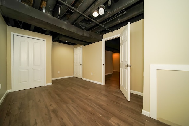 basement featuring dark hardwood / wood-style floors