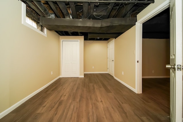 basement featuring dark wood-type flooring