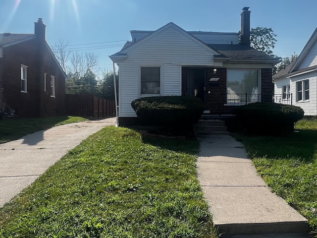 bungalow with a front yard