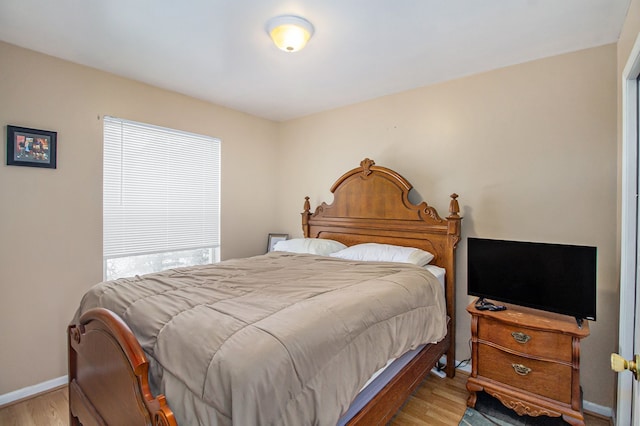 bedroom with light hardwood / wood-style floors