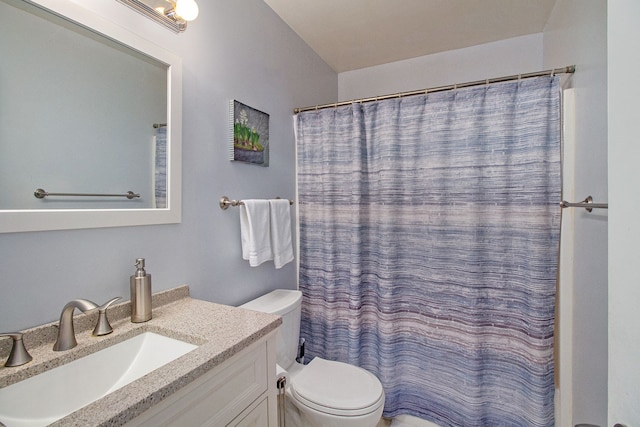 bathroom with vanity, toilet, and a shower with shower curtain