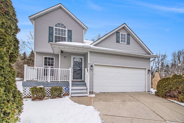 traditional home featuring concrete driveway and an attached garage