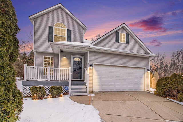 front of property with a garage and a porch