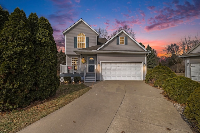 traditional home with a garage and driveway