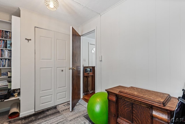 interior space featuring ornamental molding and wood-type flooring