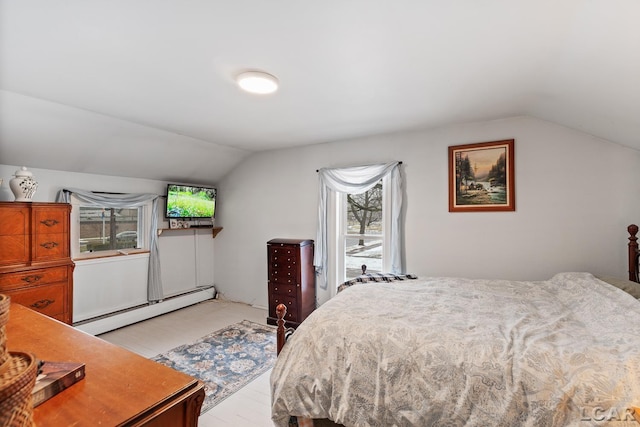 bedroom with a baseboard radiator and lofted ceiling