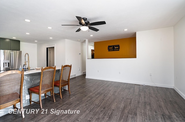 dining area featuring recessed lighting, dark wood finished floors, a ceiling fan, and baseboards