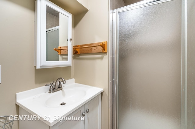 full bathroom featuring a shower stall and vanity