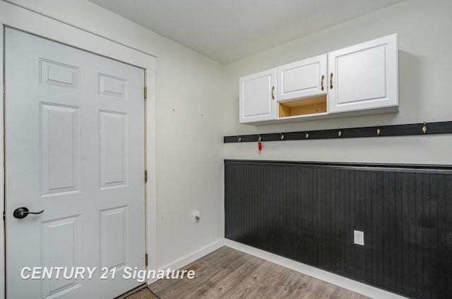 kitchen with white cabinetry, open shelves, baseboards, and wood finished floors