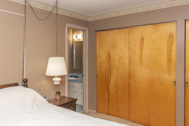 carpeted bedroom featuring sink