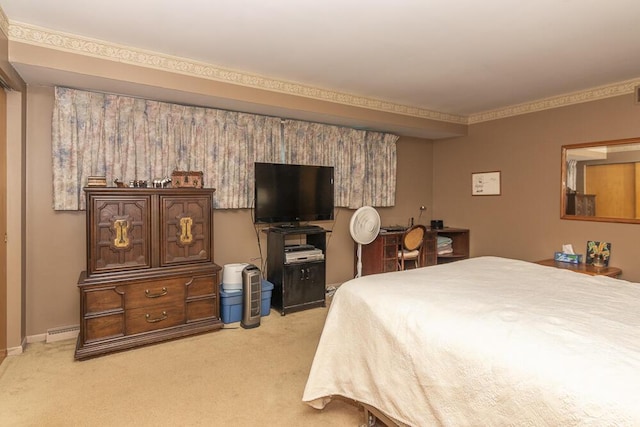 carpeted bedroom featuring crown molding