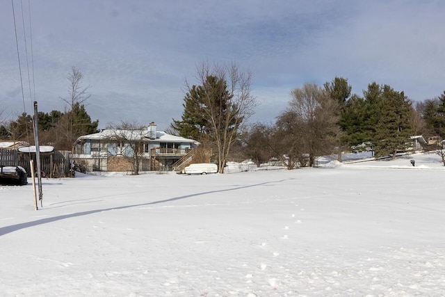 view of yard covered in snow