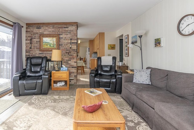 living room with wooden walls and light wood-type flooring