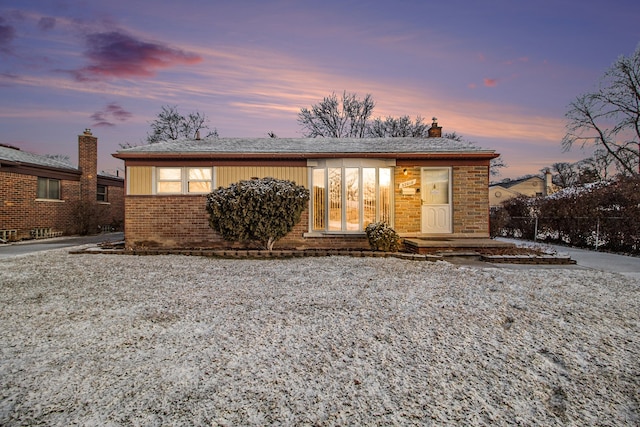 view of front of property featuring brick siding