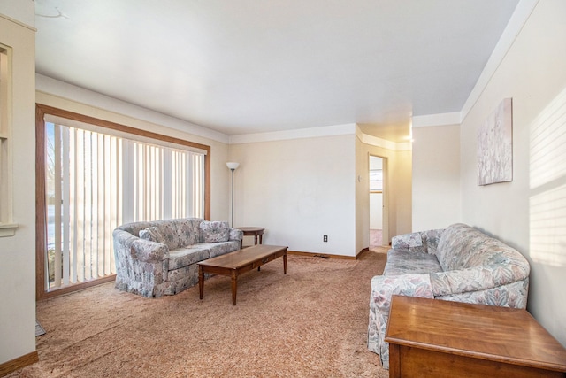 living room with carpet, baseboards, and crown molding