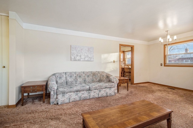 carpeted living area with visible vents, baseboards, a wealth of natural light, and an inviting chandelier