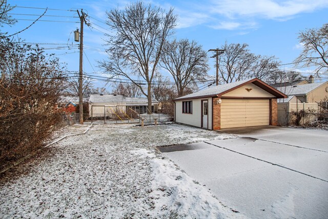 exterior space with an outbuilding and a garage