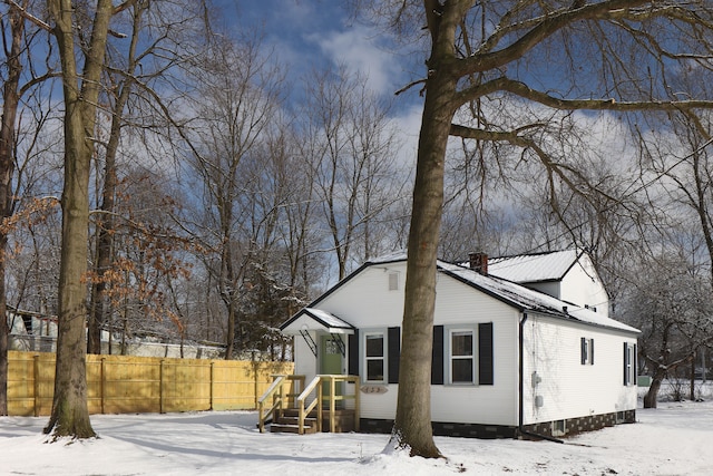 view of snow covered house