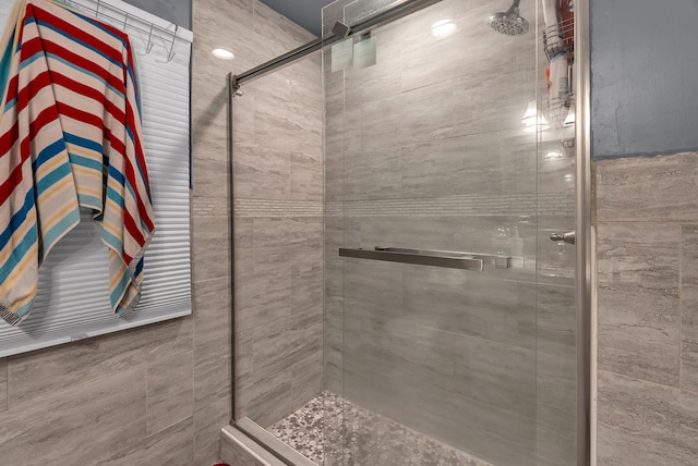 bathroom featuring an enclosed shower