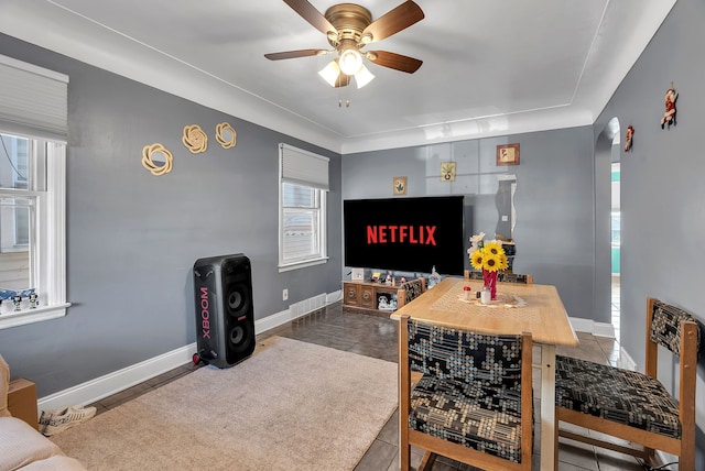 interior space with ceiling fan