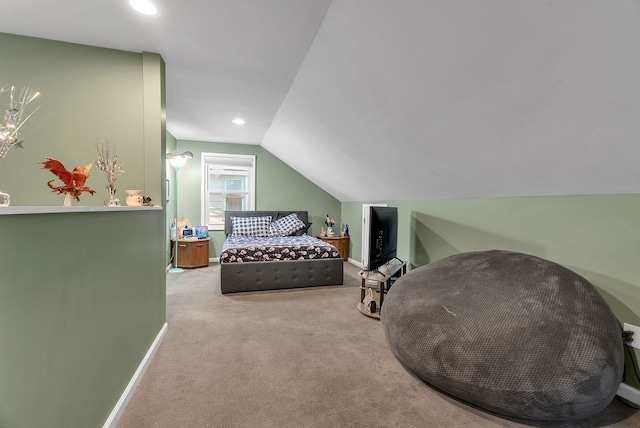 carpeted bedroom featuring lofted ceiling