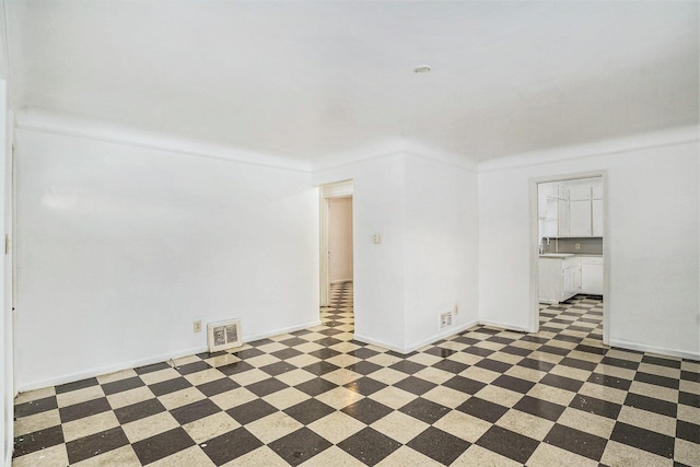 unfurnished room featuring crown molding