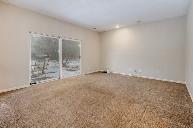 unfurnished room featuring carpet