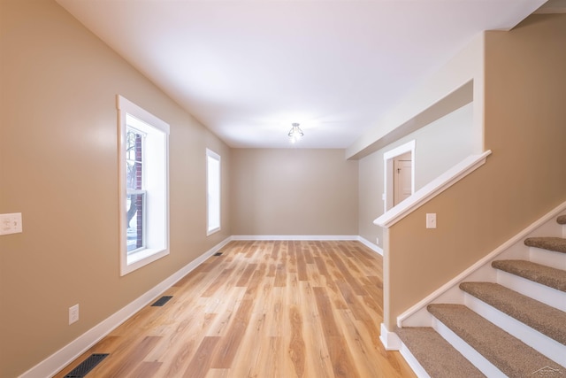 spare room featuring light wood-type flooring